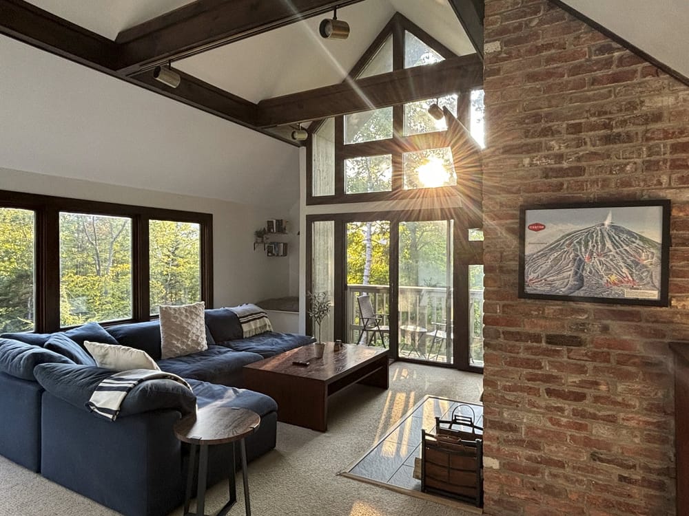 Hilltop Hideaway living room with skylights and a view to the deck