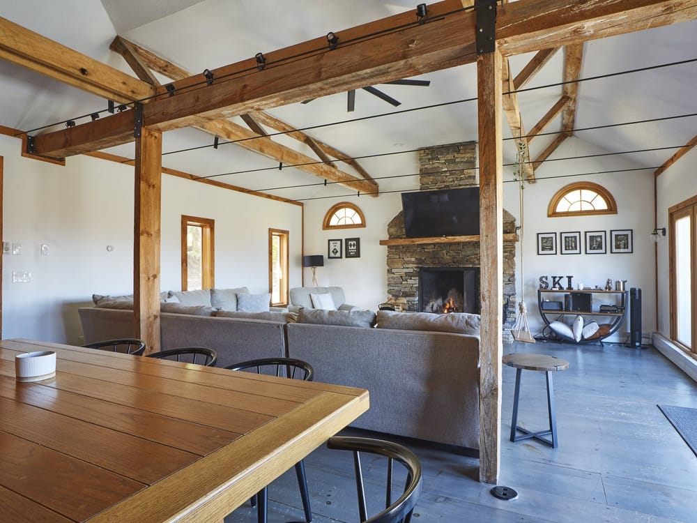 Shred Shack open living and dining area under a timber-truss ceiling